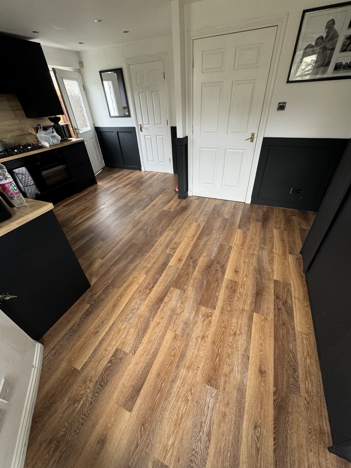 Warm plank LVT fitted throughout a domestic kitchen