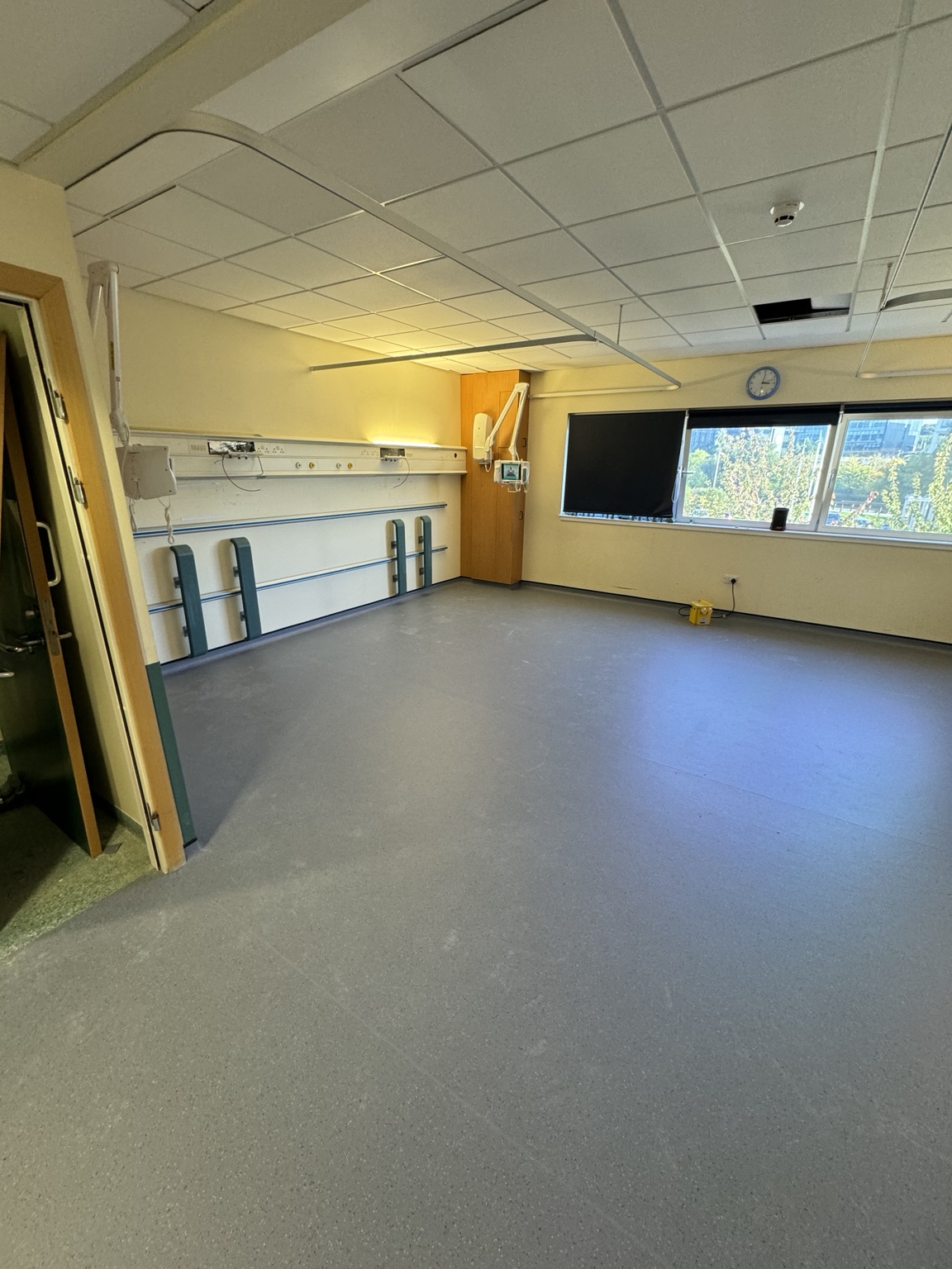 Finished safety flooring across a spacious hospital ward room
