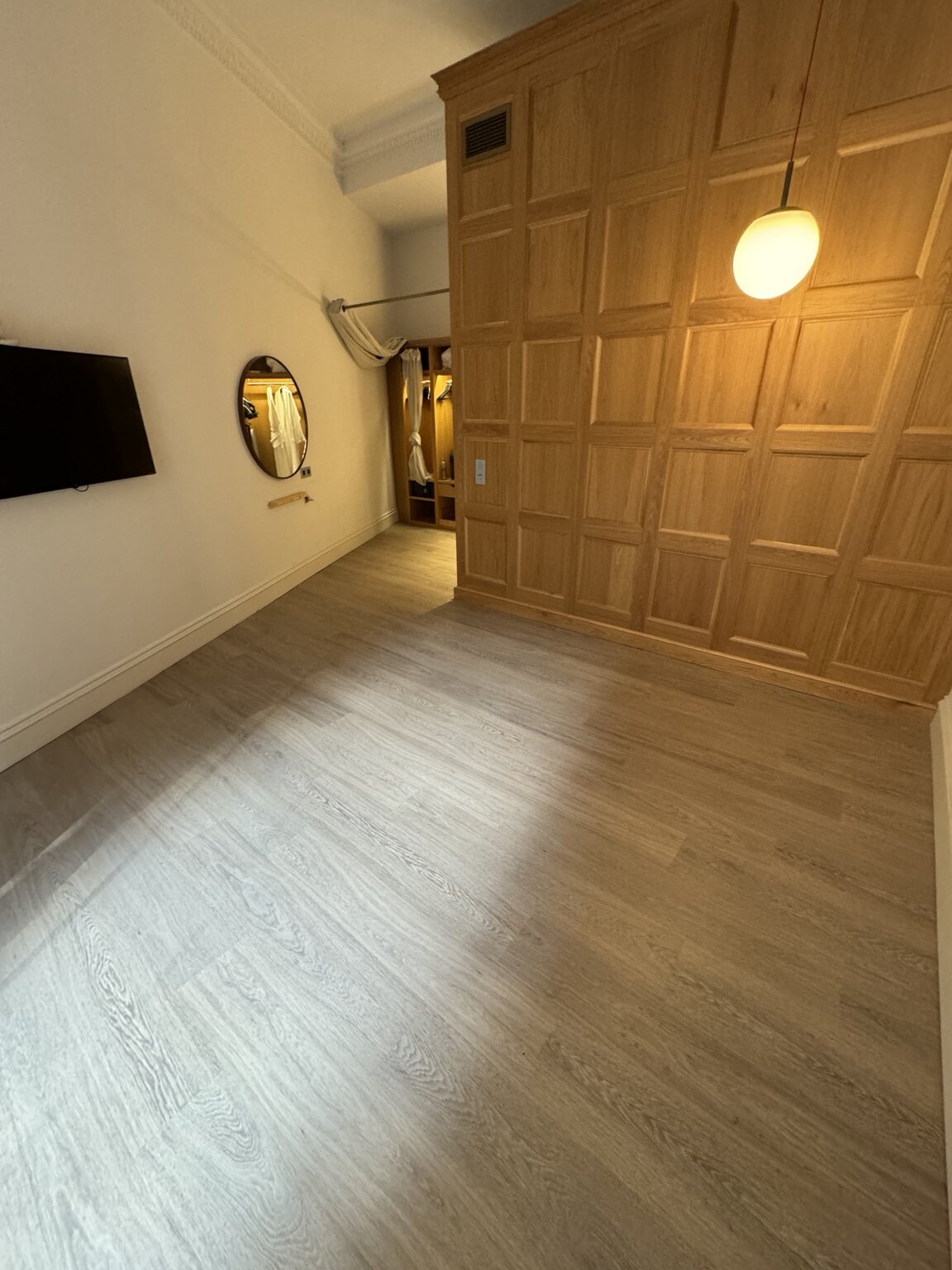 Finished wood-effect LVT in a Virgin Hotel bedroom